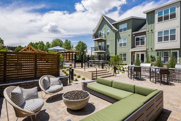 Cozy fire pit and grill area at Park 40 Apartments