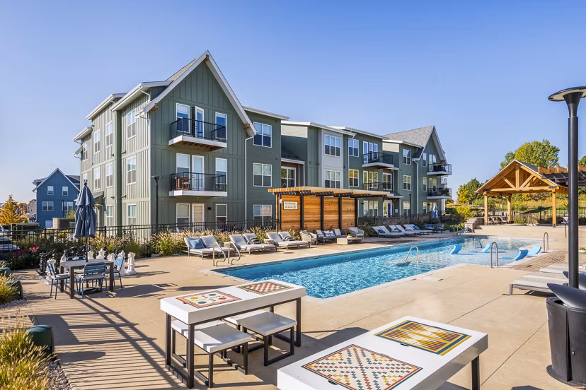 Luxurious poolside retreat at Park 40 Apartments with surrounding lounge chairs and greenery