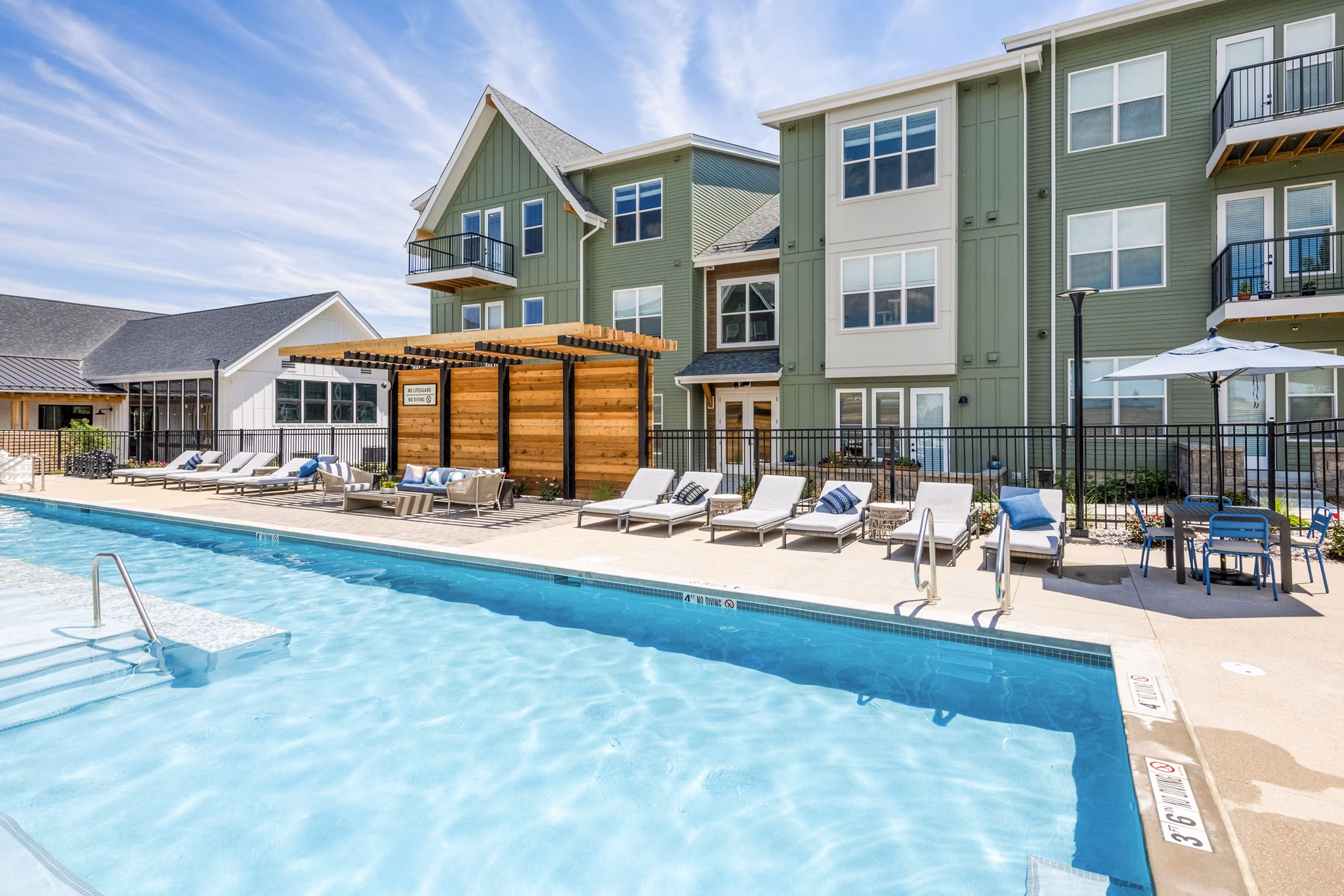 Resort-style pool with sun loungers at Park 40 Apartments, offering luxury living amenities