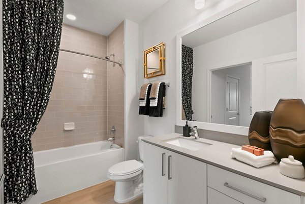 Bathroom with marble countertops and glass shower in Marlowe Ridgeview Apartments