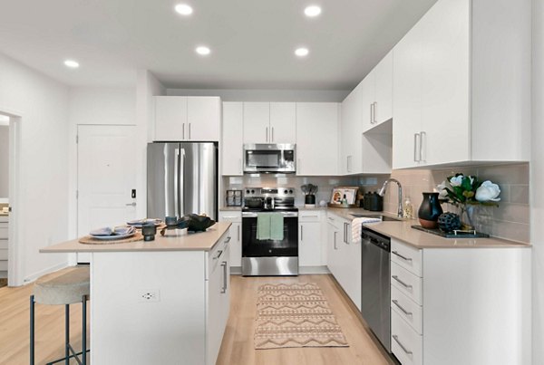 Modern kitchen featuring granite countertops and stainless steel appliances at Marlowe Ridgeview Apartments