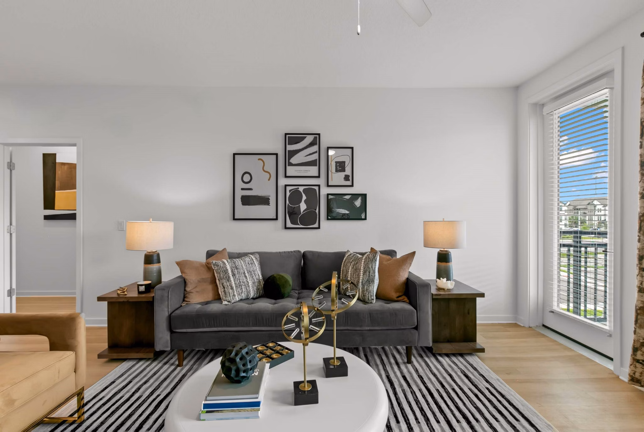 Living room with modern decor and open layout at Marlowe Ridgeview Apartments, a Greystar luxury apartment community