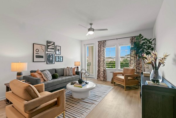 Cozy living room with modern furnishings and natural light at Marlowe Ridgeview Apartments