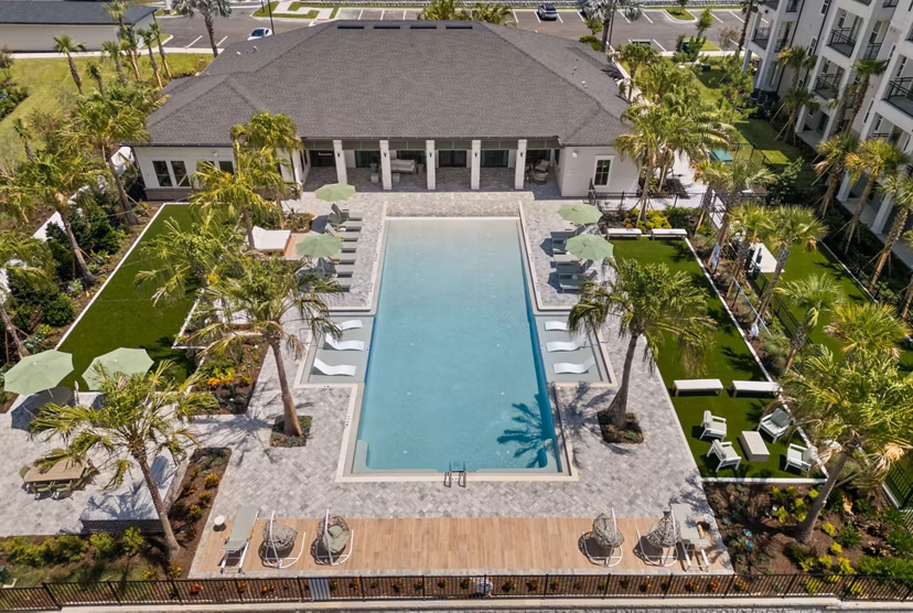 Marlowe Ridgeview Apartments: Luxurious pool area with modern loungers and cabanas for relaxation