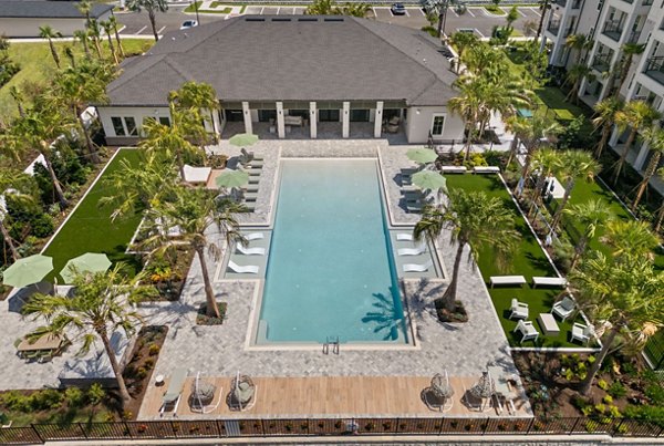 Marlowe Ridgeview Apartments: Luxurious pool area with modern loungers and cabanas for relaxation