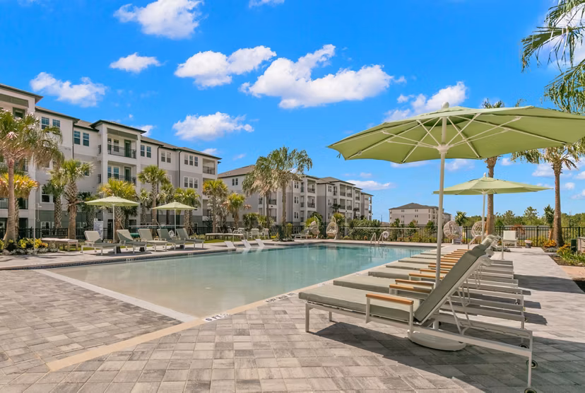 Resort-style pool with lounge chairs at Marlowe Ridgeview Apartments, offering luxury living and leisure amenities