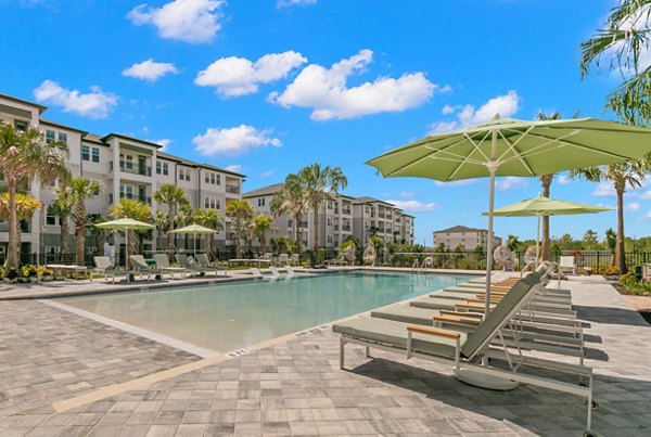 Resort-style pool with lounge chairs at Marlowe Ridgeview Apartments, offering luxury living and leisure amenities