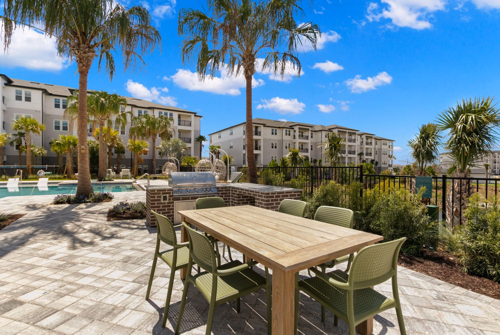 Grill area with modern stainless steel barbecue and seating at Marlowe Ridgeview Apartments, perfect for outdoor dining