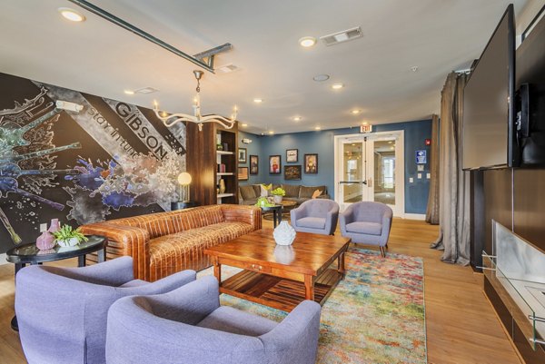 Clubhouse with modern lounge seating at The Gibson Apartments featuring luxury amenities