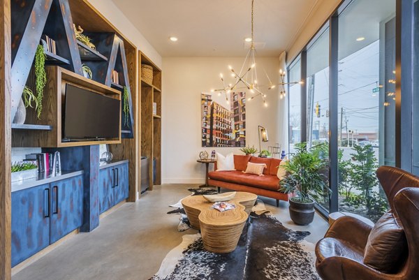 Clubhouse with modern design and seating areas at The Gibson Apartments, perfect for gatherings and social events