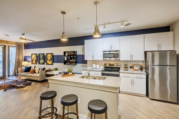 Sleek kitchen design with modern appliances at The Gibson Apartments luxury rental community