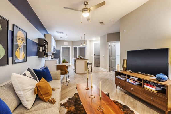 Cozy living room with modern decor at The Gibson Apartments featuring luxury Greystar living
