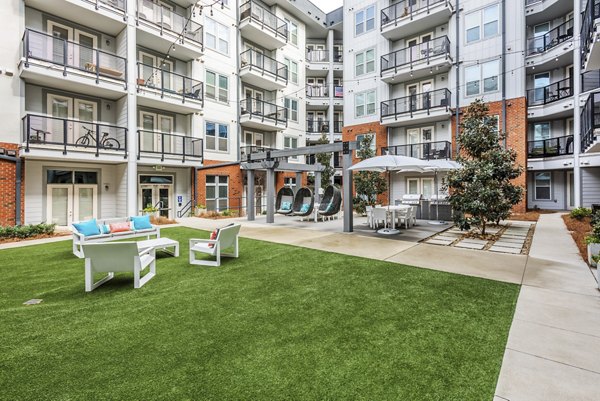 Courtyard featuring landscaped gardens at The Gibson Apartments