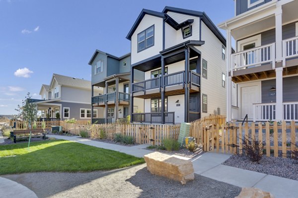 The Cottages at Erie Commons: Charming apartments with scenic landscaping in suburban Colorado