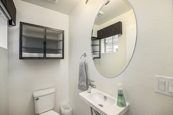 Modern bathroom with sleek fixtures at The Cottages at Erie Commons Apartments