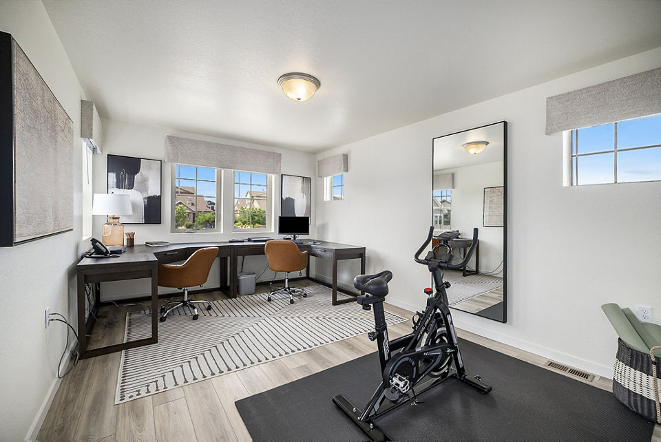 Modern fitness center with state-of-the-art equipment at The Cottages at Erie Commons Apartments