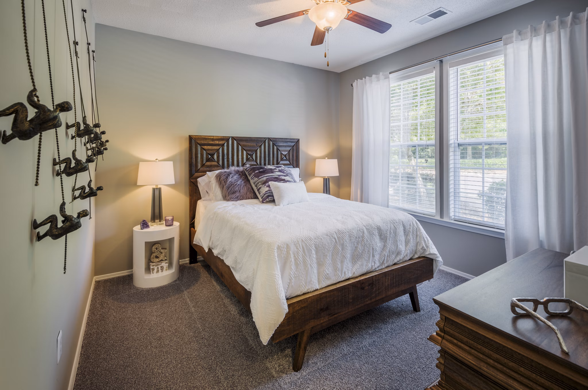 Spacious bedroom with modern decor at Arbor Steele Creek Apartments in Greystar community