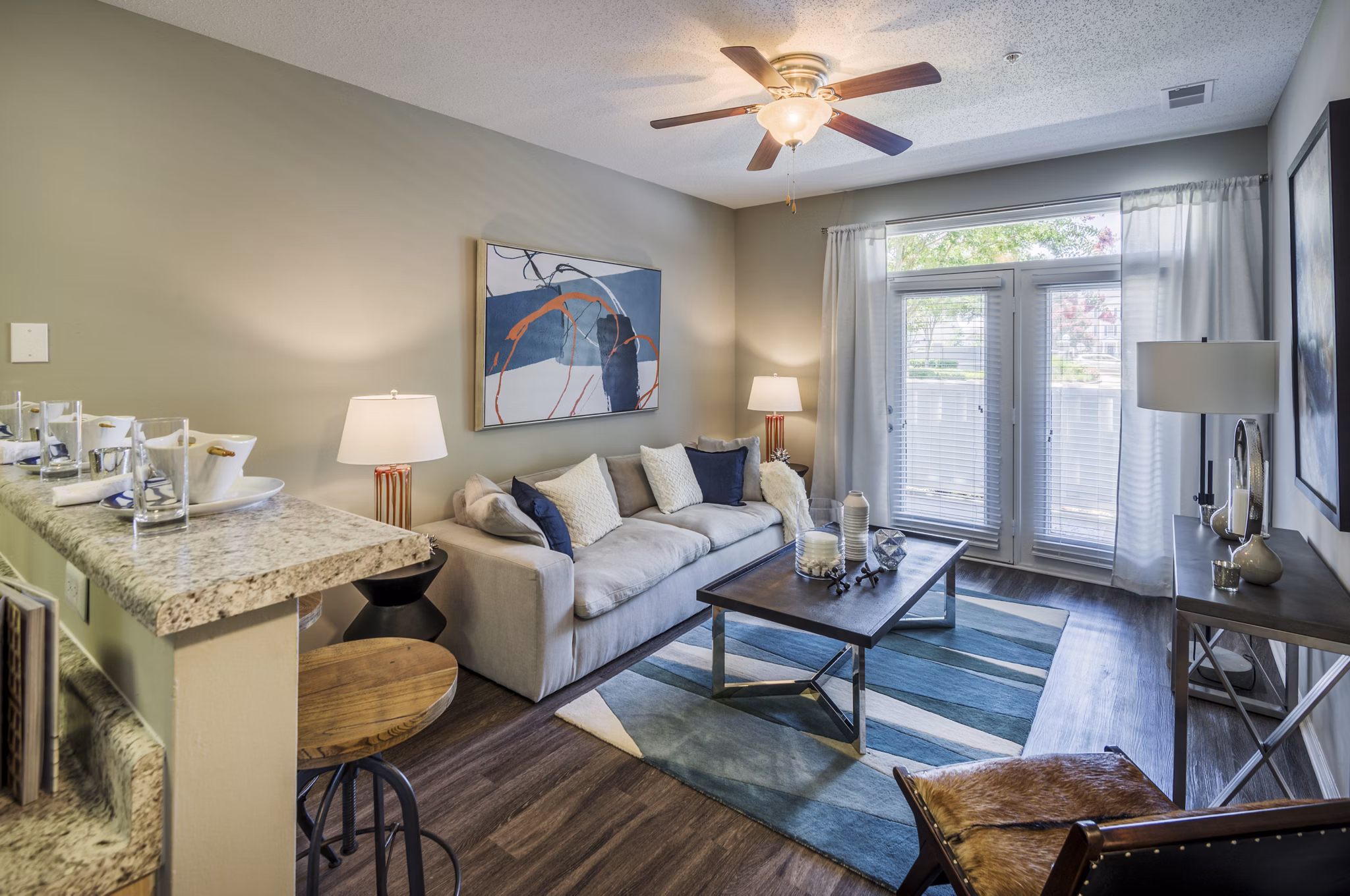 Spacious living room with modern decor in Arbor Steele Creek Apartments