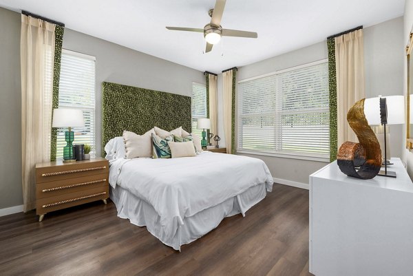 Cozy bedroom with natural light and stylish decor in Atlantic Springs Apartments
