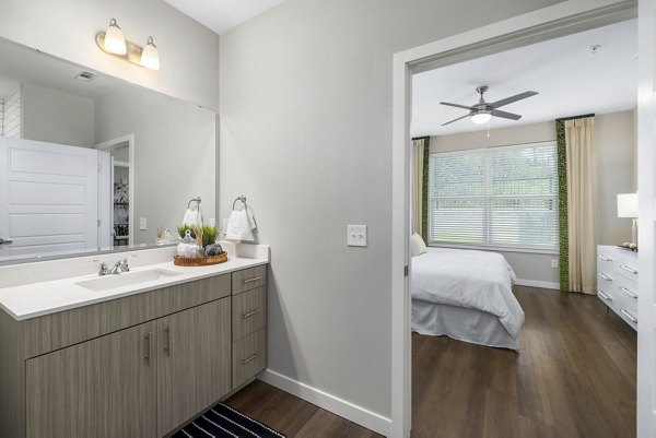 Modern bathroom with sleek fixtures in Atlantic Springs Apartments, offering luxury living in the heart of the community