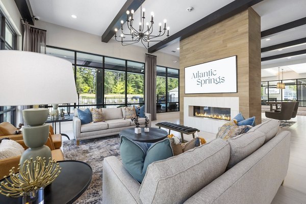 Clubhouse featuring modern decor and seating at Atlantic Springs Apartments