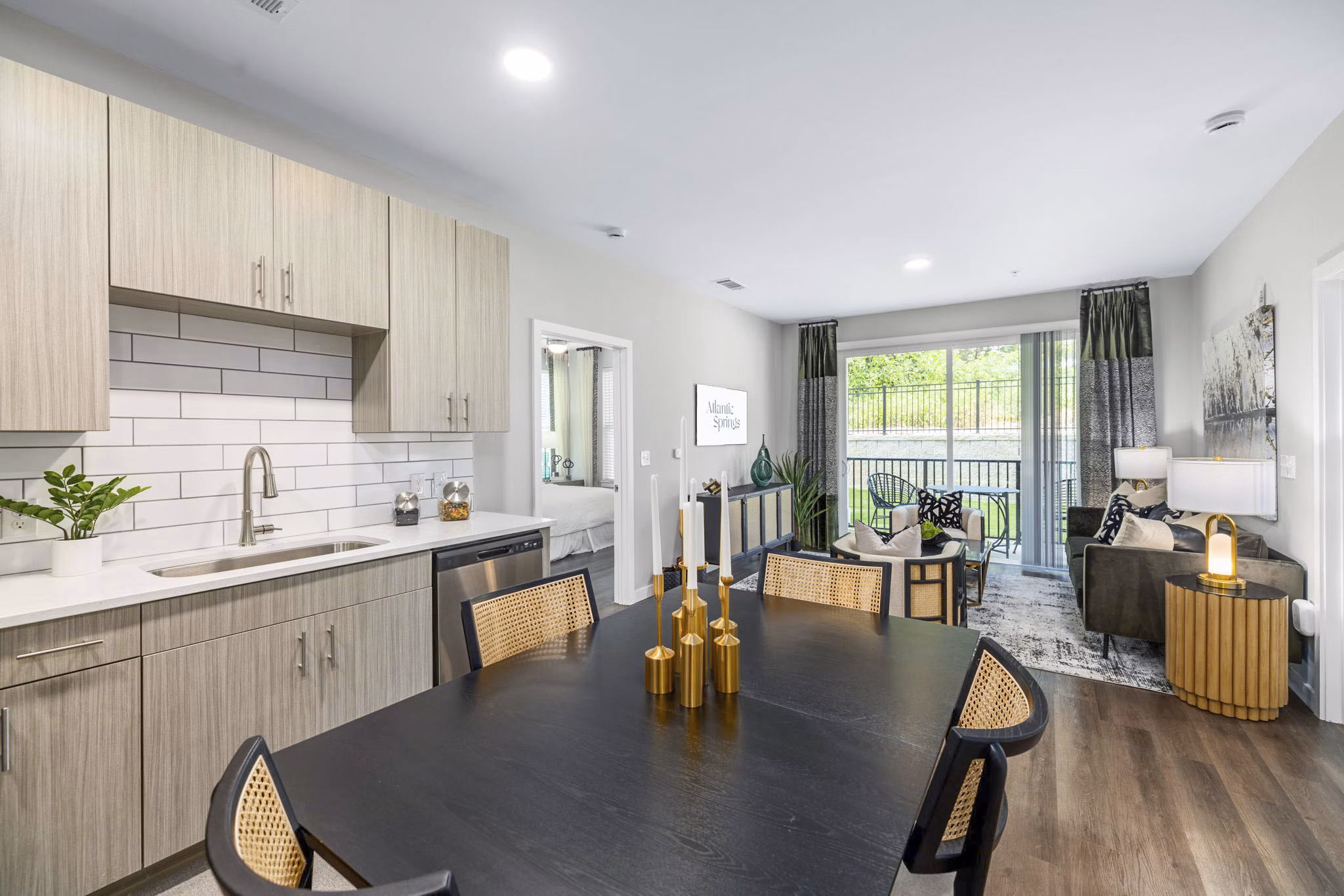 Open concept kitchen and dining room with modern appliances at Atlantic Springs Apartments