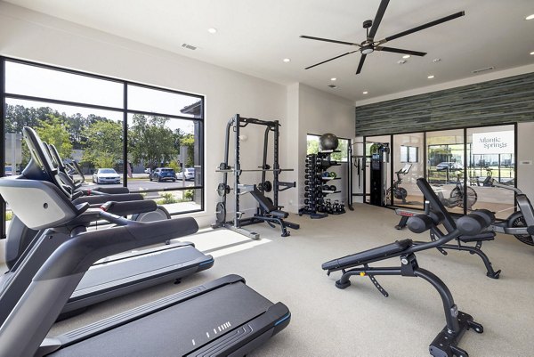 Modern fitness center equipped with state-of-the-art machines at Atlantic Springs Apartments