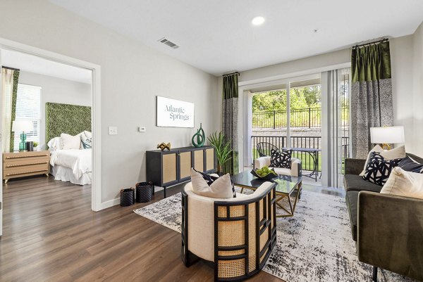 Spacious living room with modern furnishings in Atlantic Springs Apartments