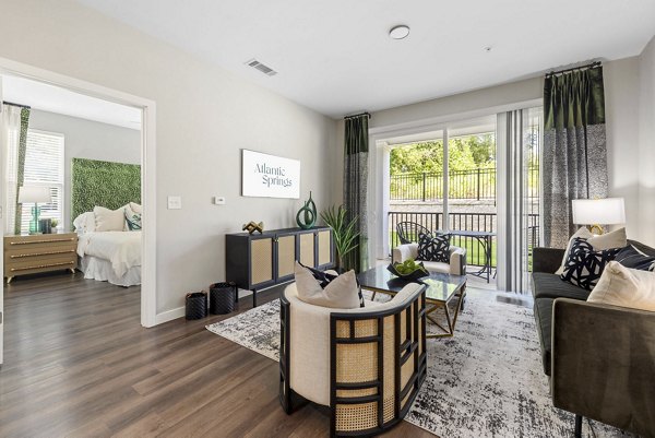 Spacious living room with modern decor at Atlantic Springs Apartments