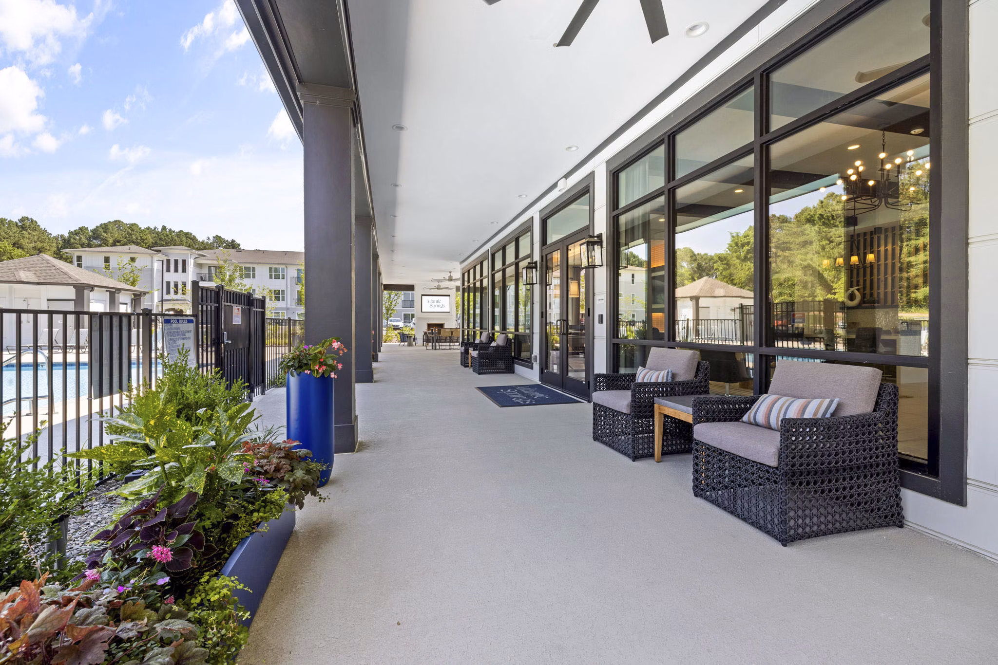 Cozy patio with modern furniture at Atlantic Springs Apartments