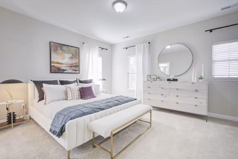Bedroom featuring elegant design elements in Charleston Row Townhomes