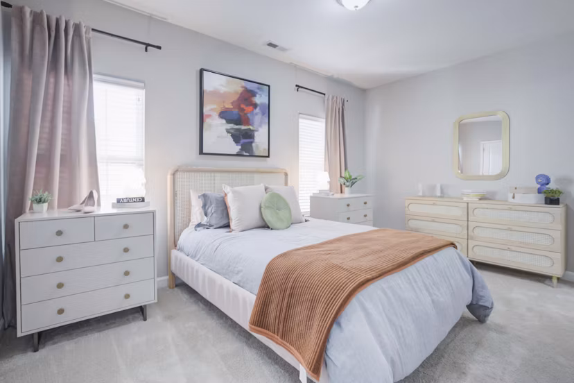 Luxurious bedroom featuring elegant furnishings at Charleston Row Townhomes