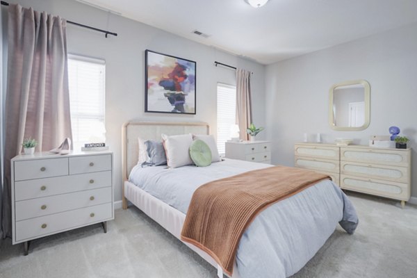 Luxurious bedroom featuring elegant furnishings at Charleston Row Townhomes