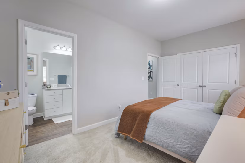 Cozy bedroom with elegant decor at Charleston Row Townhomes