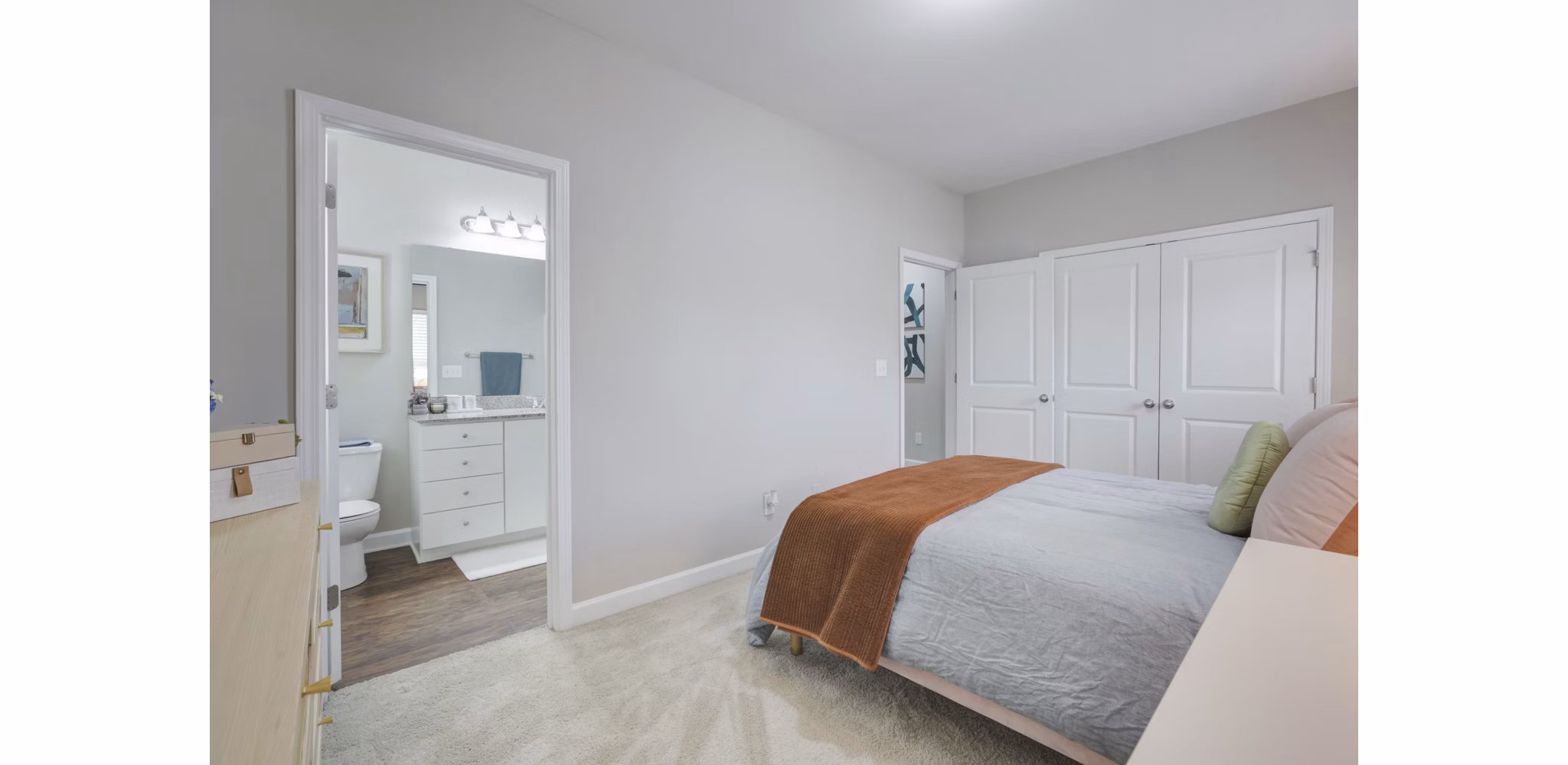 Cozy bedroom with elegant decor at Charleston Row Townhomes