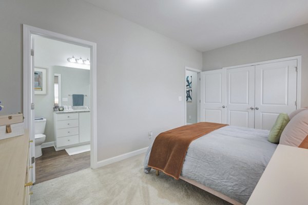 Cozy bedroom with elegant decor at Charleston Row Townhomes