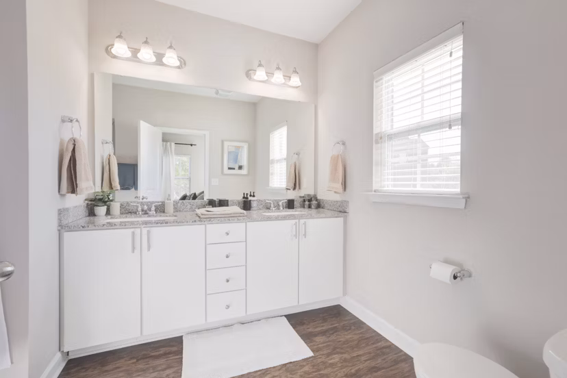 Modern bathroom with marble countertops and sleek fixtures in Charleston Row Townhomes