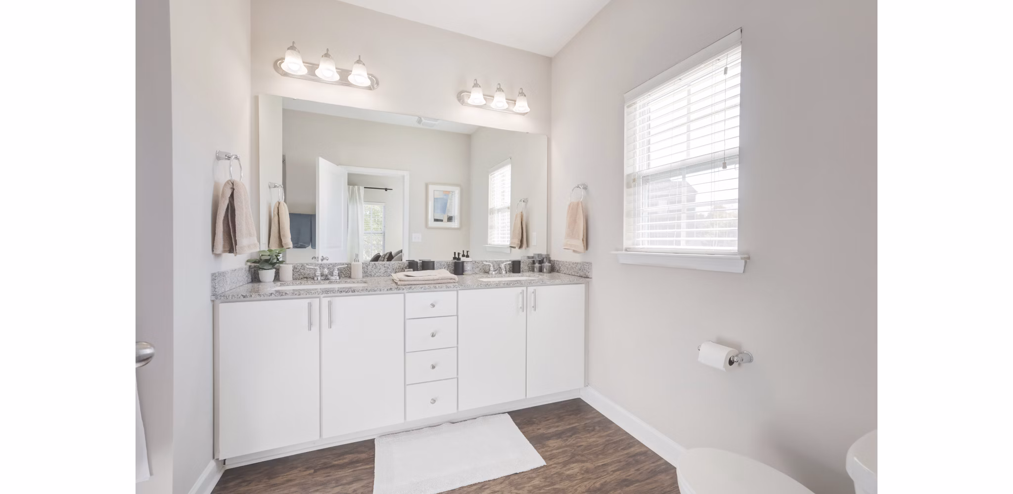 Modern bathroom with marble countertops and sleek fixtures in Charleston Row Townhomes