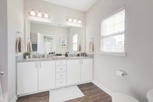 Modern bathroom with marble countertops and sleek fixtures in Charleston Row Townhomes