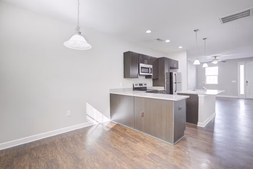 Dining area featuring modern decor at Charleston Row Townhomes, luxurious apartments living by Greystar