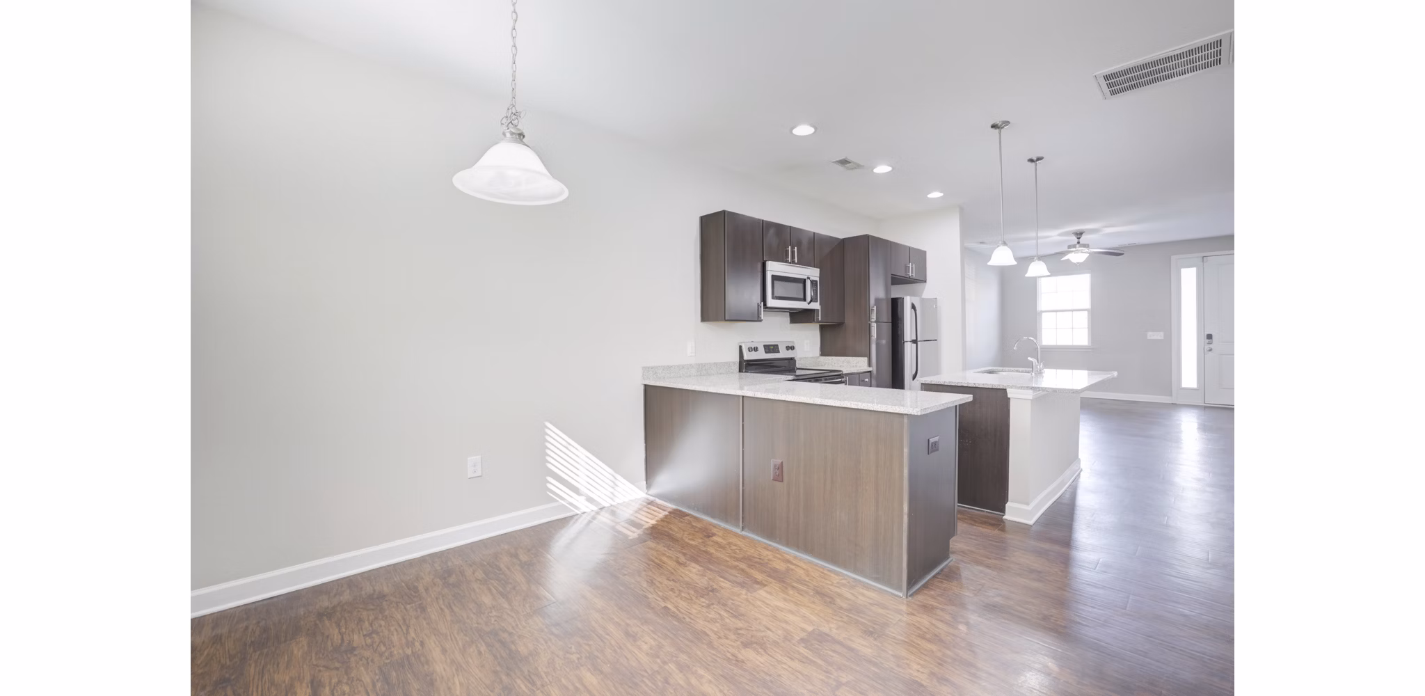 Dining area featuring modern decor at Charleston Row Townhomes, luxurious apartments living by Greystar