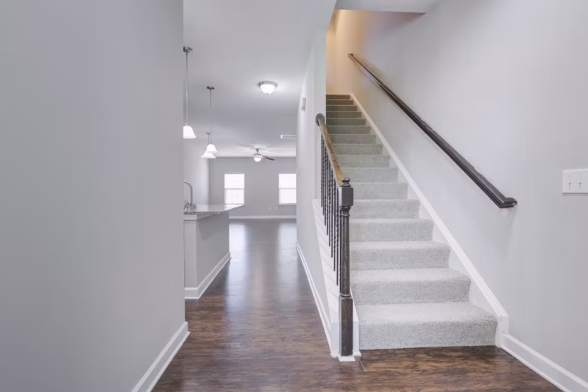 Contemporary hallway with recessed lighting in Charleston Row Townhomes
