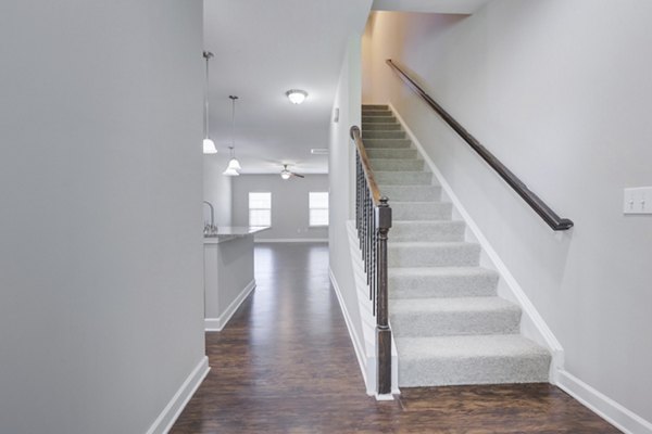 Contemporary hallway with recessed lighting in Charleston Row Townhomes