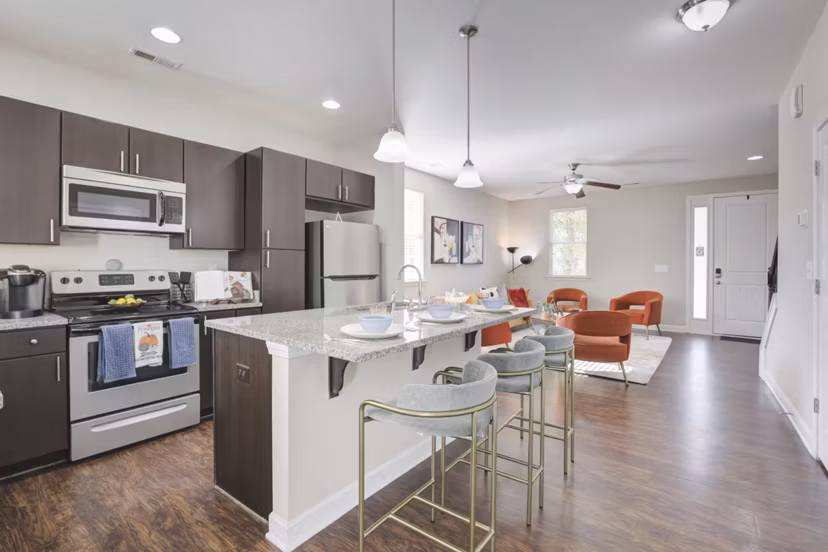 Modern kitchen with stainless steel appliances at Charleston Row Townhomes