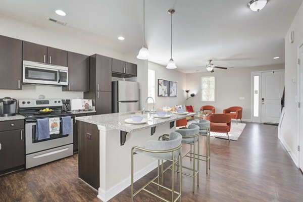 Modern kitchen with stainless steel appliances at Charleston Row Townhomes