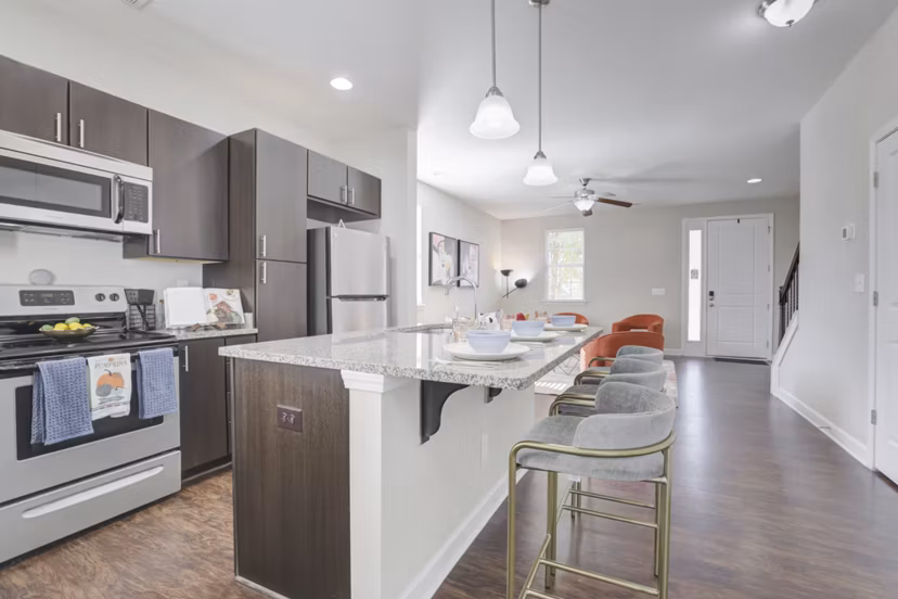 Modern kitchen with stainless steel appliances in Charleston Row Townhomes