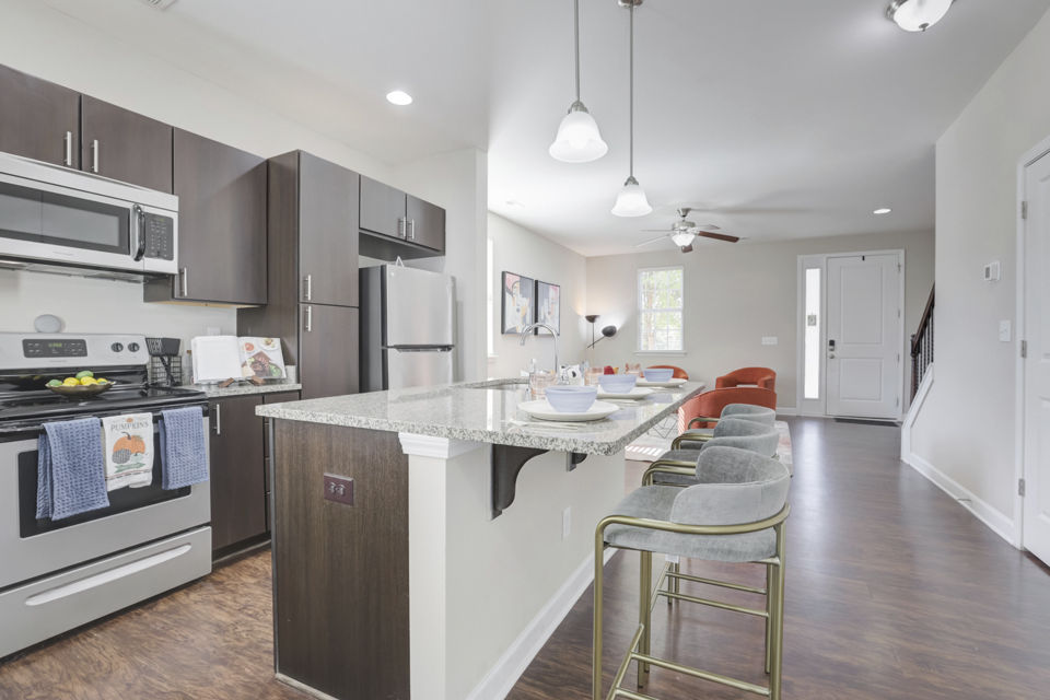 Modern kitchen with stainless steel appliances in Charleston Row Townhomes