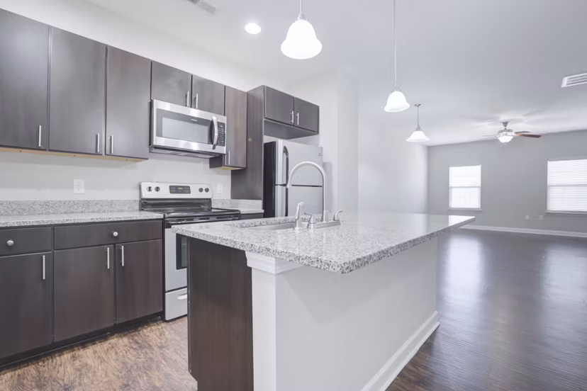 Modern kitchen with stainless steel appliances at Charleston Row Townhomes