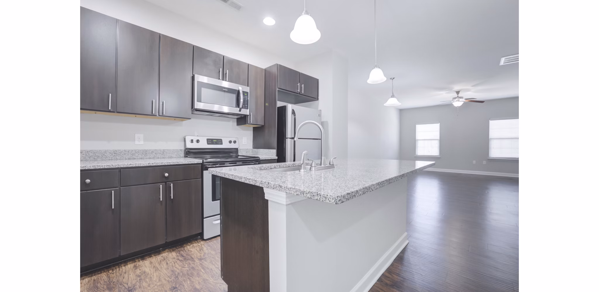 Modern kitchen with stainless steel appliances at Charleston Row Townhomes