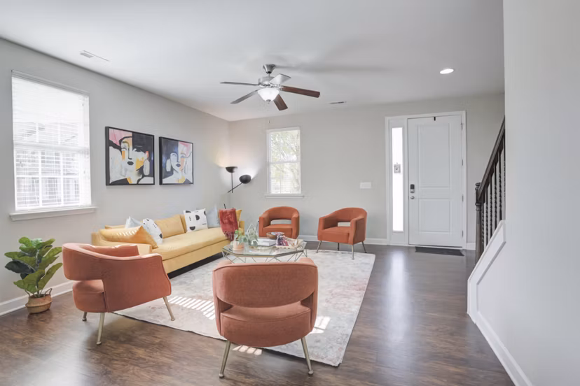 Spacious living room with modern furnishings at Charleston Row Townhomes